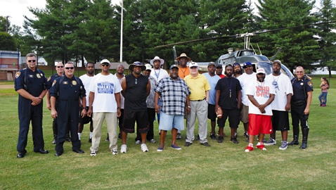 Photo by Dan Andrews. Members of the Austin-East Baby Roadrunners Board and the Knox County Sheriff’s Department join forces to run a football camp that kicks off the 2014 season for the Baby Roadrunners. The sheriff’s department has been involved for a decade.