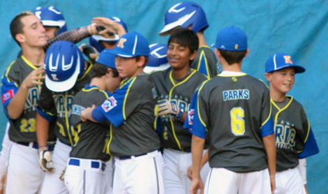 PHOTO BY CAROLYN GRENKOSKI Karns Little Leaguers celebrate one of their seven home runs in a 23-1 District 6 championship win over McMinn County.