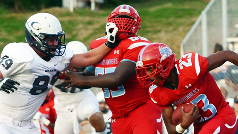 Photo by LaRay of Come 2 Me, Come 2 You Photography Grace Christian Academy junior defensive end Rhett Elwood (89) and Austin-East freshman tackle Calvin Wilson battle in the trenches as freshman Jahson Jackson looks for running room Friday night. The Rams blanked the Roadrunners 14-0 in the season opener at A-E. 