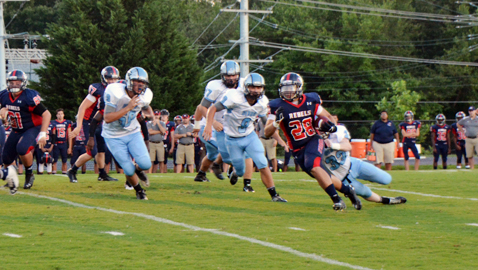 West High running back Trust G’Bendah eludes a host of Gibbs defenders Thursday night at the KOC Kickoff Classic. The event was played before a full house at Central High’s Dan Y. Boring Stadium. Photo by Dan Andrews.