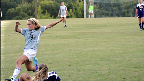 Bearden's Clarity Voy (9) tangles with Clarksville's Gybson Roth in Thursday night's opener of the Bearden Invitational. The Lady Bulldogs and Lady Wildcats played to a 3-3 tie at Bruce Allender Field.