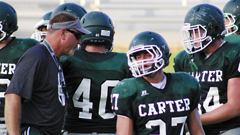 PHOTO BY MARSHA BRANCH Jeff McMillan walks the sideline during a preseason scrimmage against Halls. McMillan, a standout on Carter’s 1976 team, will be in his first game as the Hornets’ head coach Thursday night against Gibbs.