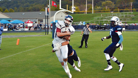 Photo by Dan Andrews, South-Doyle’s Dylan Cameron (in white) hauls in a 16 yard touchdown pass from Brody Rollins to give the Cherokees an early 7-0 lead against Hardin Valley on Friday night. The 10th ranked Cherokees improved to 3-0 on the year with a 47-21 road win over the Hawks.
