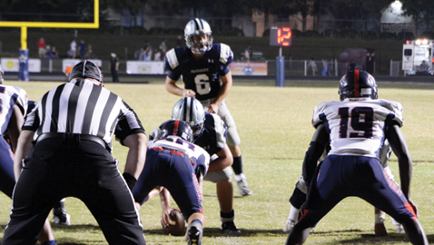 Photo by Dan Andrews. Farragut quarterback Jacob Naumoff prepares to take a snap against West Friday night. Naumoff threw for 324 yards in  his best outing of the season. It wasn’t enough as the Admirals lost a shootout to the Rebels 49-30.