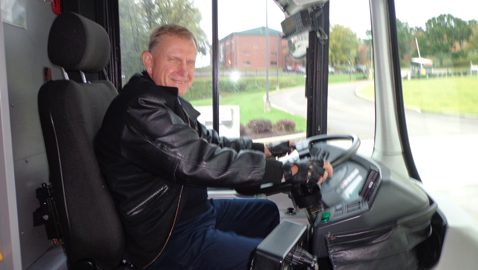Luke Johnson, retiring after 36 years as a Knoxville bus driver, is behind the wheel last week during one of his last runs. Photo by Mike Steely.