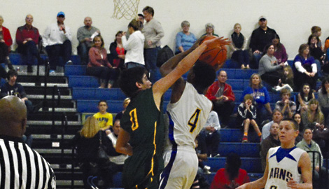Karns Middle's Cartez Campbell attempts a layup as Cedar Bluff's Ethan Stone defends. Campbell scored 12 points to lead the Beavers to a 74-27 victory over the Giants.