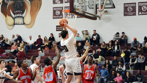 Bearden’s Austin Duncan (20) shoots a layup while Austin-East defender Lucky Clark looks on. Duncan scored 18 points for the Bulldogs in a 92-63 win over the Roadrunners Thursday night. With the win, Bearden kept its perfect record intact.