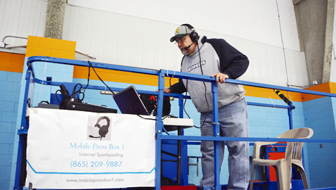 Photo by Dan Andrews. Former radio sports director Chuck Sebastian takes his craft to the internet. His company, Mobile Press Box 1, streams live broadcasts of KAHA High School hockey games.