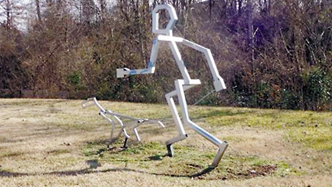 Photo by Mike Steely. Along the Third Creek Greenway you might chance across this sculpture. The greenway sees lots of dog walkings, bikers, runners, and people enjoying a strip of nature in the city.