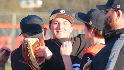 PHOTO BY KRISTY TETER OF KT PHOTOGRAPHY Peyton Alford gets a hug from Powell High head coach Jay Scarbro as the Panthers celebrate the junior southpaw’s perfect game in a 3-0 win at Clinton last week.
