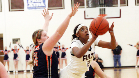 Fulton sophomore KeKe McKinney splits two Grainger defenders to put up a shot in the Class AA sectional game. The Lady Falcons' season came to an end with a 59-46 loss at Jody Wright Arena.