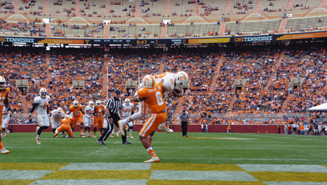 Photo by Dan Andrews. Tennessee sophomore tight end Ethan Wolf hangs onto the football for a touchdown in the annual Orange & White Game, which was played on April 25th at Neyland Stadium.