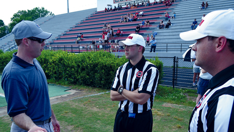 Lee Hedrick (left) instructs officials at the East Tennessee clinic in May at Central High  School. Hedrick will be a new full-time official in the Southeastern Conference this fall.  Hedrick will be a Center Judge, a new position in SEC crews this season. 