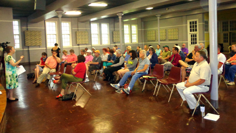 Photo by Mike Steely Members of various neighborhoods listen to Commissioner Amy Broyles’ update on the attempt to preserve the Howard Home on North Broadway.