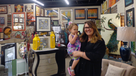 Rachel Clopton and her daughter Naomi stand in part of the Affordable & Unique Home Accents showroom in Powell. (Photo by Mike Steely)