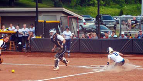 PHOTO BY DAN ANDREWS Hardin Valley Academy shortstop Leslie Beecham slides past Seymour’s Reid Ballard and into home with the Lady Hawks’ first run against the Lady Eagles in a Section 1-AAA game at HVA Friday night. The Lady Hawks prevailed 8-3 and punched their ticket to this week’s State Tournament.