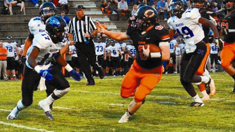 Aaron Watson, Clinton High’s male Student-Athlete of the Year, runs for yardage against Karns. Watson also was a standout in wrestling.