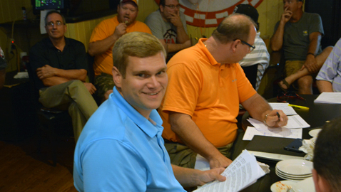 Photo by Dan Andrews. Knoxville News-Sentinel coach Zane Duncan ponders his pick at Wednesday night’s Pilot Rocky Top League Draft at Doc’s All-American Grille.