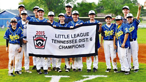Karns displays the District 6 Little League championship banner after posting a 13-3 win over Maryville Thursday night. Players (left to right): Harrison Garrett, Jackson Campbell, Matthew White, Matthew Bringle, Ty Vineyard, Tyler Nicely, Payton Adkisson, Jacob Parker, Ben Smith, Johnny Eller and Jordin Vinson. Coaches (left to right): Mike Vineyard, Rob Eller and Taco Bell.