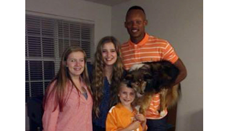 Lizzie, Ali and Caroline (left to right) "fell in love" with UT quarterback Joshua Dobbs when he visited the home of David Fisher, his mentor during his internship in May. Dobbs also was fond of the Fishers' dog, a Sheltie named Titan.