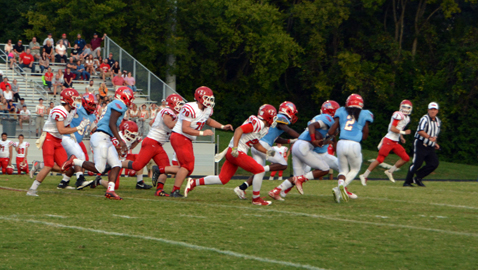 PHOTO BY DAN ANDREWS Austin-East scoops and scores a defensive touchdown on this play to take the lead against Halls Friday night at A-E. The Roadrunners won, 46-22.