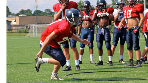 PHOTO BY WYNNE EMPSON-PETTIGREW Senior Cole Skavara goes through a linebacker drill on a hot August day last week at West High School. The start of 2015 high school football season is less than two weeks away. The annual Knoxville Orthopedic Clinic Kick-Off Classic gets underway Thursday night, Aug. 13,  at Central High School and continues Friday night at West High, with games beginning each night at 7. The regular season for local teams begins August 20-22.