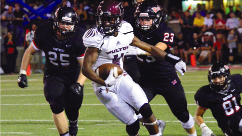 PHOTO BY COURTNEY RADER Fulton junior wide receiver Zach Dobson made some big plays against Maryville in the Battle of Champions despite a 49-18 loss. Red Rebels Dylan DoLozier (25) and Tyler Zwolinski (23) chase the fleet Falcon.
