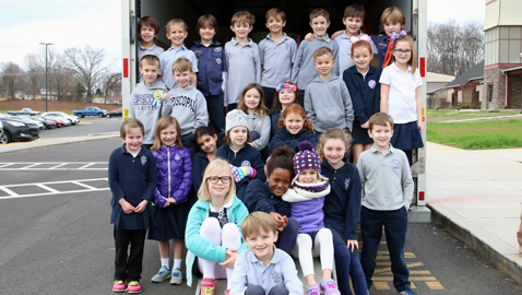 Episcopal First Graders Take Truckloads to Holiday Bureau