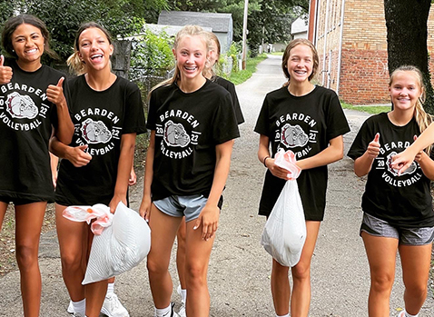 HELPING HANDS:  Bearden volleyballers build picnic tables for Lonsdale kids